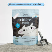 Sac de litière Jilypet naturelle et agglomérante avec pelle sur fond clair.
